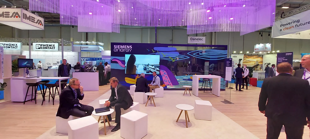 Siemens Energy trade fair booth at SMM Hamburg 2024 with live tape art activation by TAPE OVER Berlin
