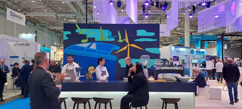 Visitors engaging with the live tape art activation at the Siemens Energy booth, SMM Hamburg 2024