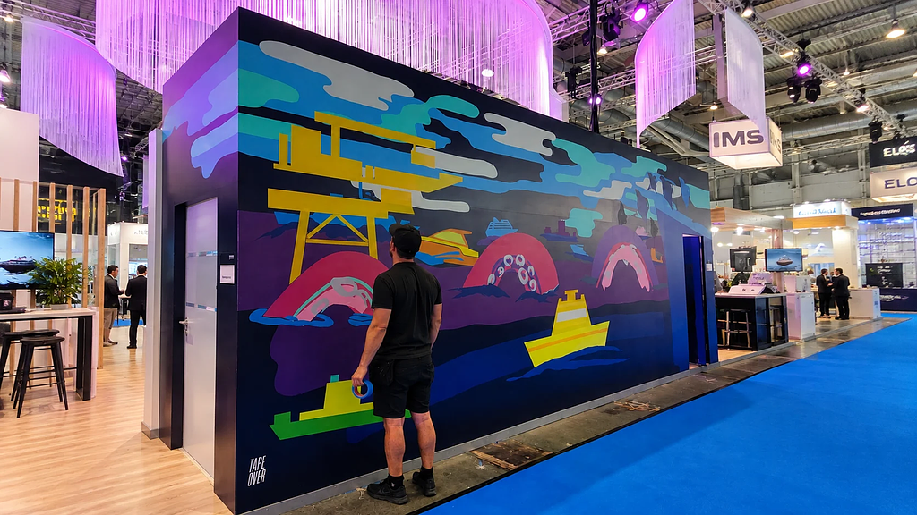 Behind the scenes of the TAPE OVER tape art process at the Siemens Energy SMM Hamburg booth activation