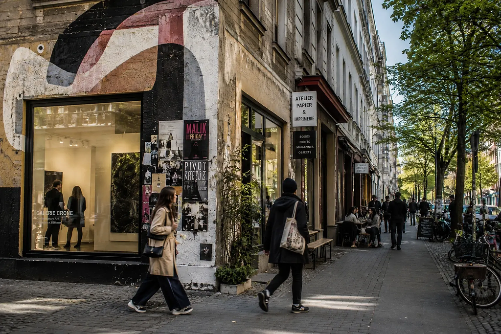 European city street showing the coexistence of art, culture, and urban commercial life